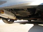Looking down low and underneath.  Painted black is the resonator (furthest to the right) and the exhaust pipe.