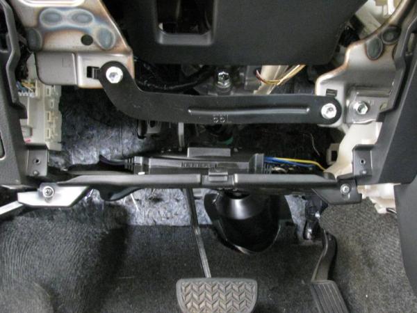 Line output converter mounted to panel above drivers feet (you can just barely see the top of it). It's completely hidden behind the panel under the steering wheel.