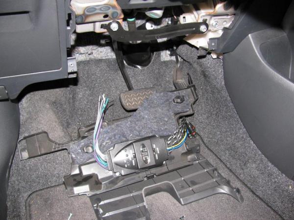 Here's the line output converter (not wired) mounted to the hidden panel.