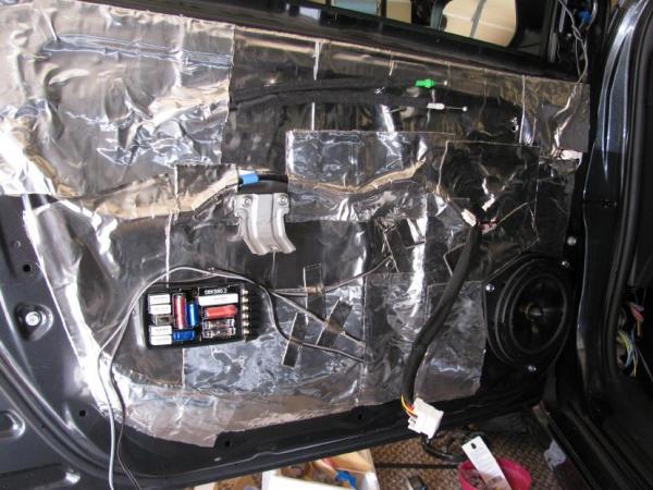 RAAMmat fully applied on door panel. Crossover mounted but currently with it's cover off. Speaker mounted too.